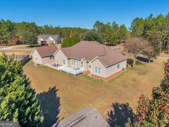 an aerial view of a house with a garden