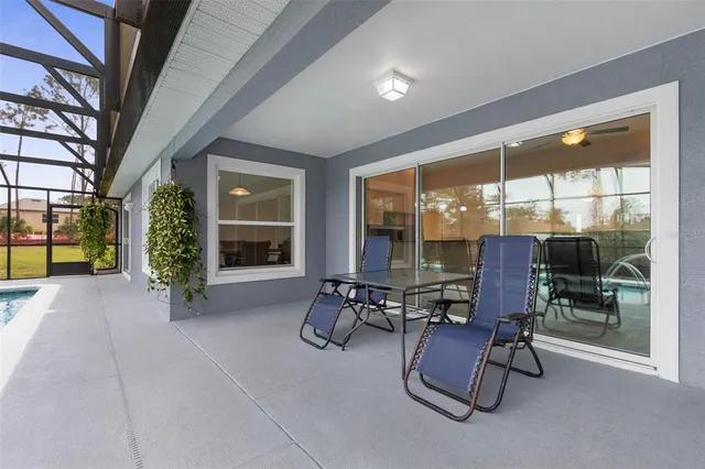 a view of a livingroom with furniture and a window