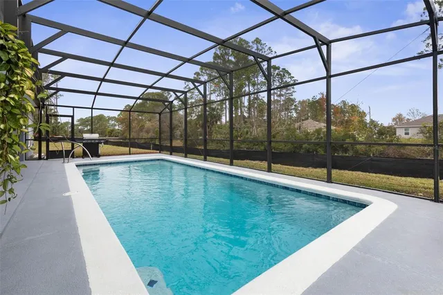 a view of a swimming pool with a patio