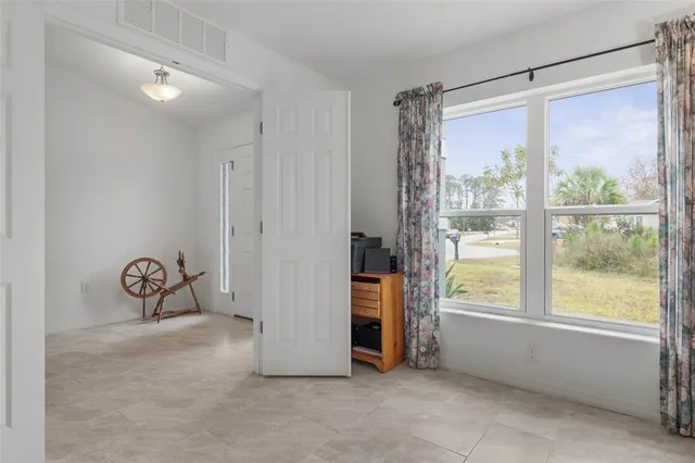 a bedroom with a bed and a ceiling fan
