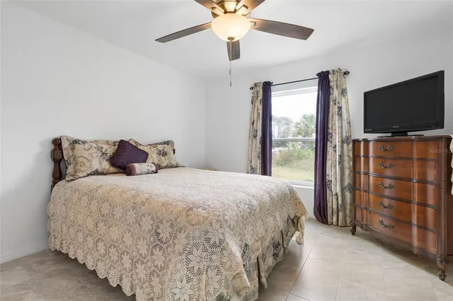 a bedroom with a bed and a cabinet