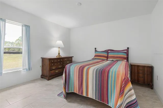 a view of a house with pool and sitting area