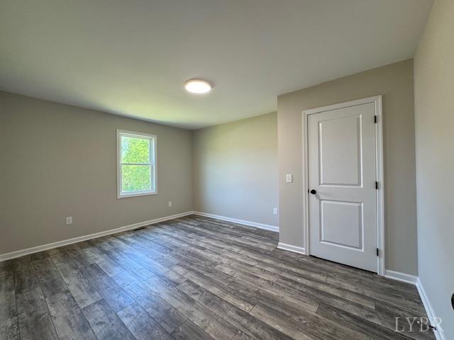 2248 Spg Grv Road Spout Spring, VA 24593 - Photo 12 of 22 an empty room with wooden floor and window