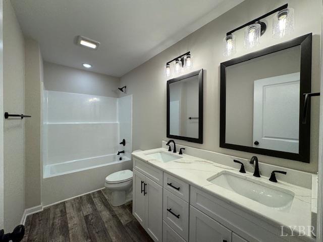2248 Spg Grv Road Spout Spring, VA 24593 - Photo 14 of 22 a bathroom with a double vanity sink toilet mirror and shower