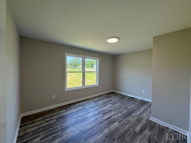 2248 Spg Grv Road Spout Spring, VA 24593 - Photo 15 of 22 an empty room with wooden floor and windows