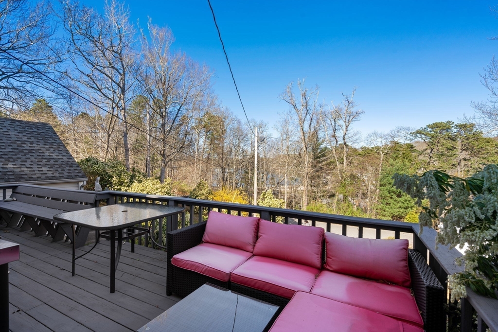 11 W Road Sandwich, MA 02644 - Photo 13 of 42 a balcony with table and chairs