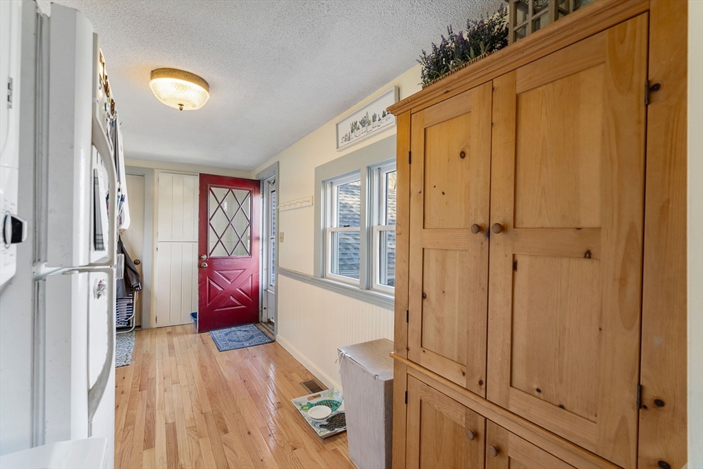 11 W Road Sandwich, MA 02644 - Photo 21 of 42 a view of a hallway with entryway wooden floor and front door