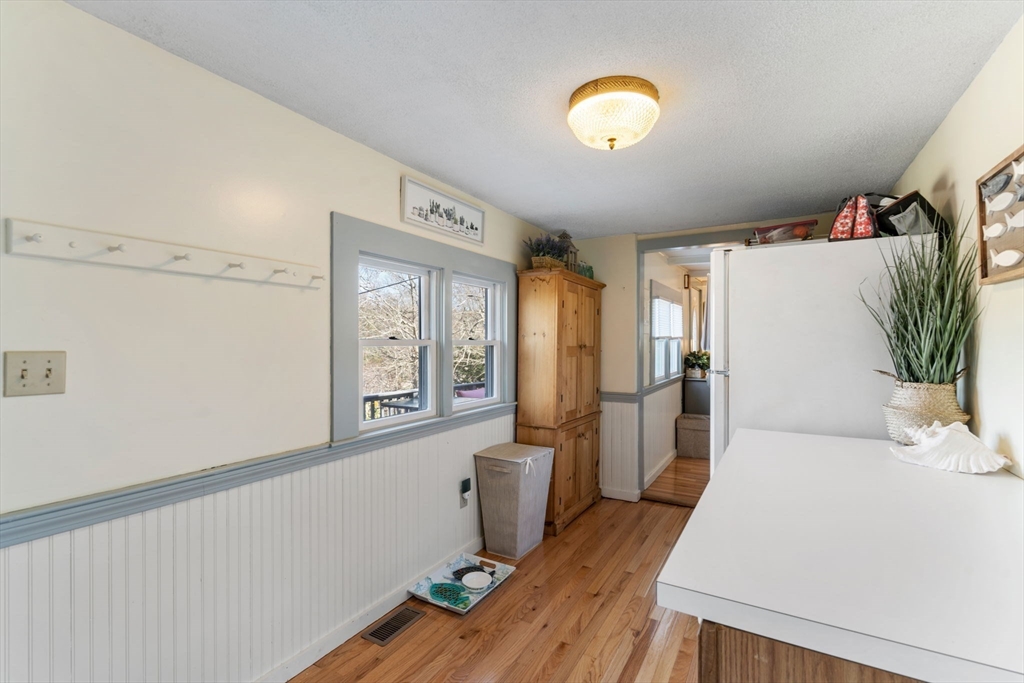 11 W Road Sandwich, MA 02644 - Photo 23 of 42 a view of a hallway with wooden floor and cabinet