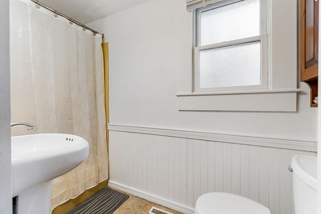 11 W Road Sandwich, MA 02644 - Photo 28 of 42 a bathroom with a sink toilet and window