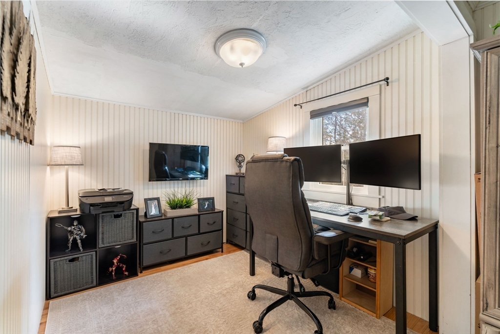 11 W Road Sandwich, MA 02644 - Photo 29 of 42 a view of a workspace with furniture and a flat screen tv