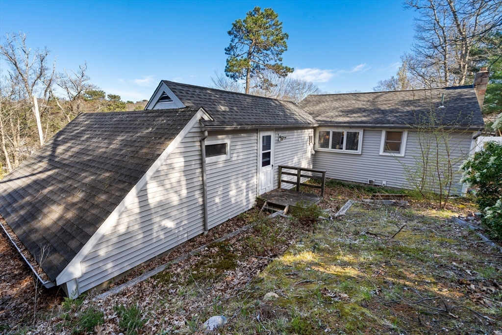 11 W Road Sandwich, MA 02644 - Photo 32 of 42 a house view with a backyard space