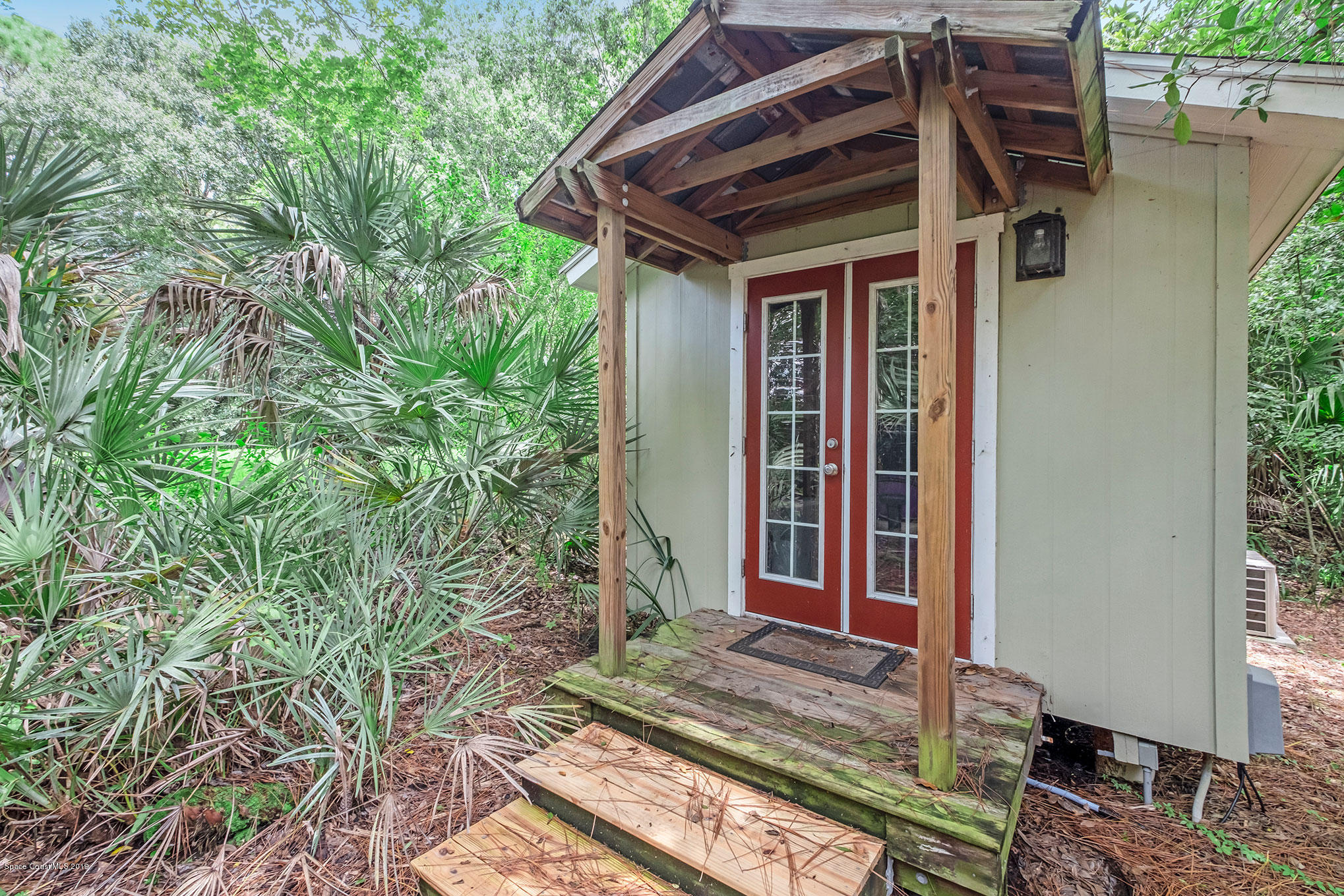 1567 Masters Road Northwest Palm Bay, FL 32907 - Photo 22 of 25 a view of house with backyard