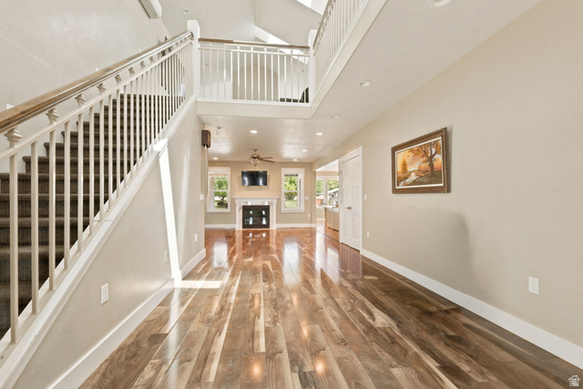 580 North 300 East Logan, UT 84321 - Photo 23 of 74 Spacious interior featuring wood-finish flooring, a grand staircase with white balusters, and recessed lighting