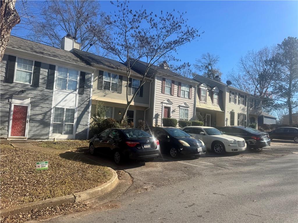 1416 Stonegate Point Stone Mountain, GA 30083 - Photo 3 of 5 a front view of a house with cars parked