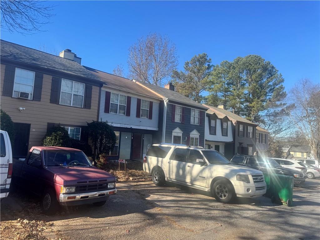 1416 Stonegate Point Stone Mountain, GA 30083 - Photo 4 of 5 a front view of a house with a garden
