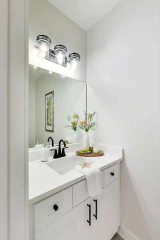 a bathroom with a sink and a mirror