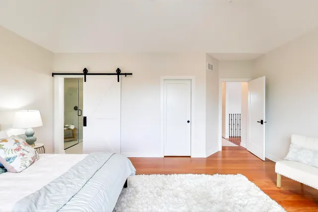 a bedroom with a bed and a walk in closet