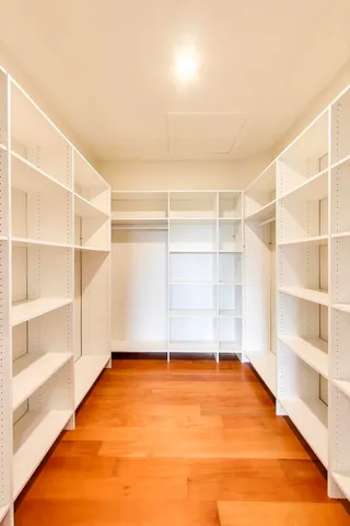 a view of an empty room with a empty shelves