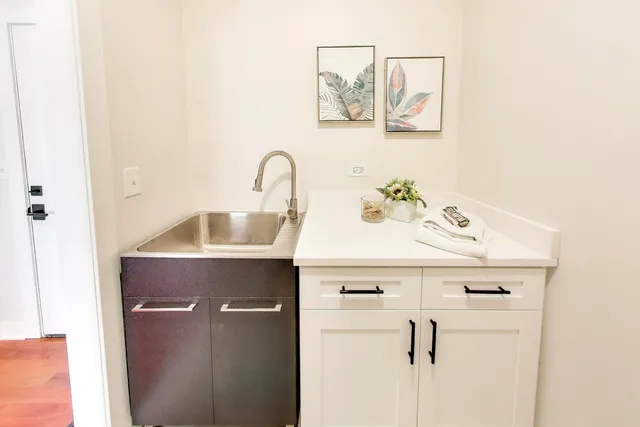 a close view of utility room with washer and dryer