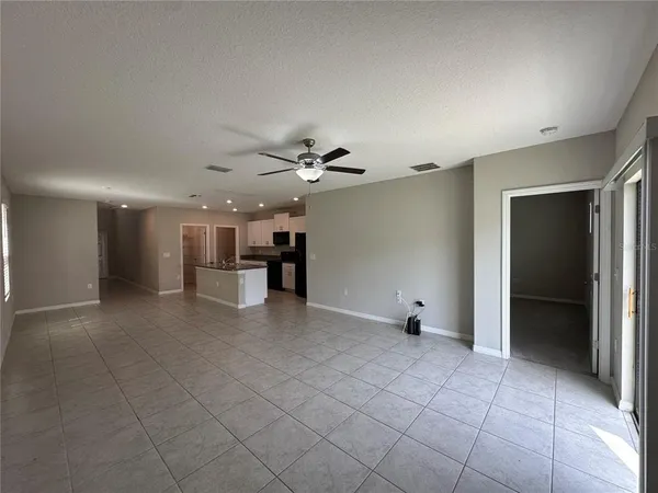 a view of a livingroom with a furniture and a ceiling fan