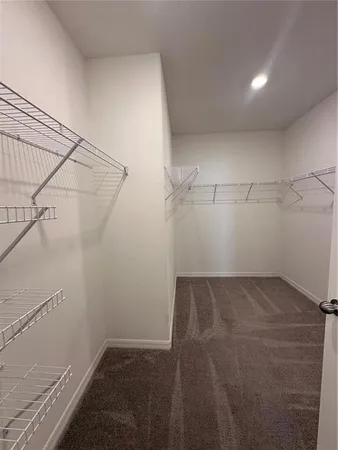 a view of a room with racks on the wall