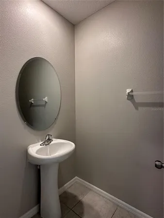 a bathroom with a sink and mirror