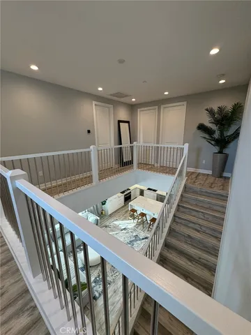 a view of kitchen with furniture and wooden floor