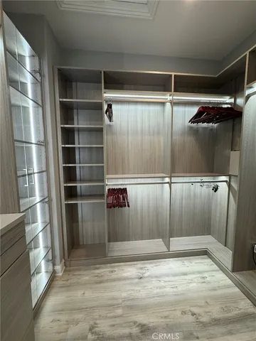 a bathroom with a tub a sink and mirror