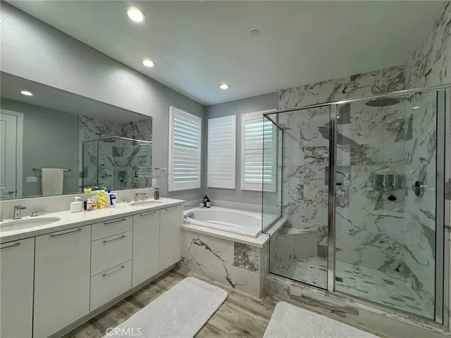 a white toilet sitting next to a shower