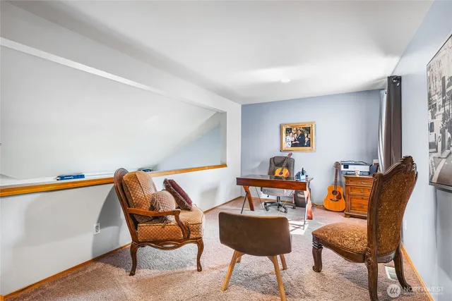 a living room with furniture and a rug