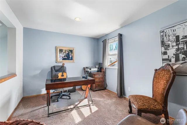 a workspace with furniture and a window