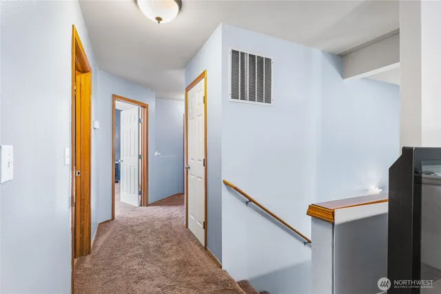 a bedroom with a bed lamp and window