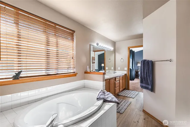 an aerial view of residential houses with outdoor space and swimming pool