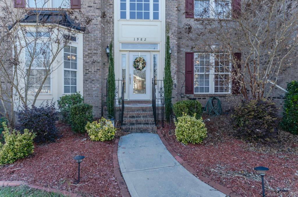 1982 Faison Avenue Fort Mill, SC 29708 - Photo 2 of 24 a view of a pathway with brick walls