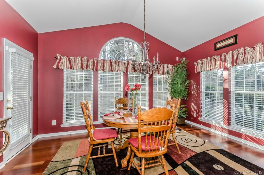 1982 Faison Avenue Fort Mill, SC 29708 - Photo 11 of 24 a dining room with furniture a chandelier and wooden floor