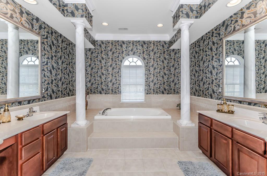 1982 Faison Avenue Fort Mill, SC 29708 - Photo 16 of 24 a spacious bathroom with a tub sink and mirror