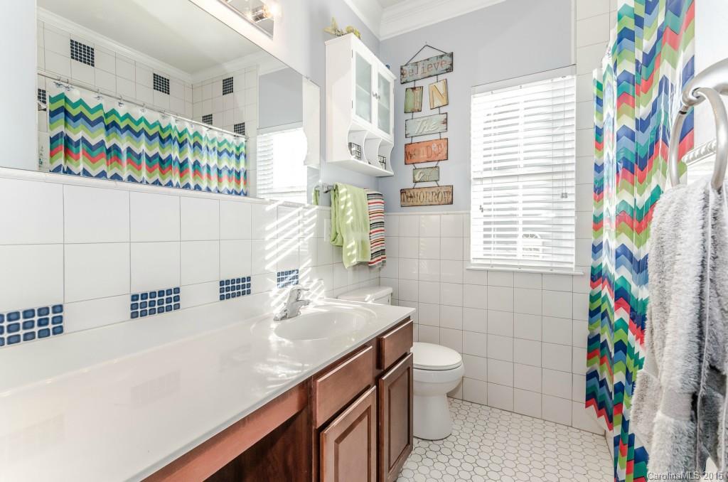 1982 Faison Avenue Fort Mill, SC 29708 - Photo 19 of 24 a bathroom with a sink a vanity and a shower curtain