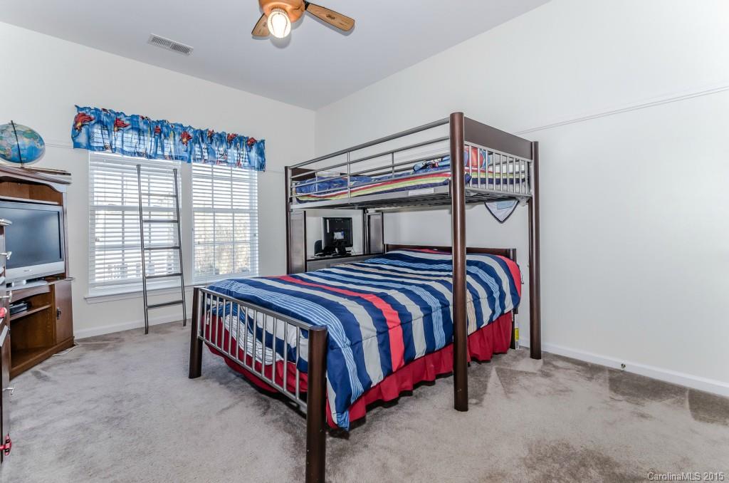 1982 Faison Avenue Fort Mill, SC 29708 - Photo 21 of 24 a bedroom with a bed next to a window