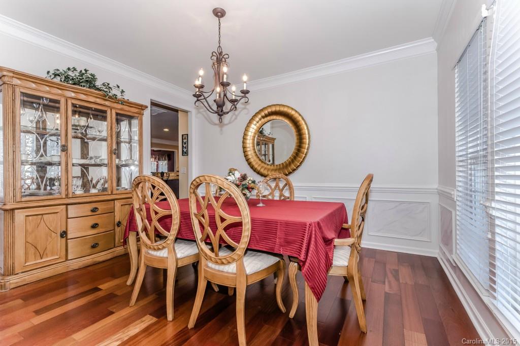 1982 Faison Avenue Fort Mill, SC 29708 - Photo 4 of 24 a view of a dining room with furniture chandelier and wooden floor
