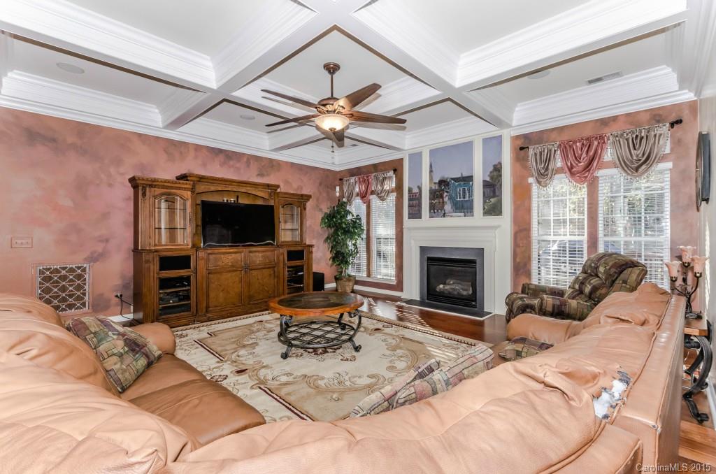 1982 Faison Avenue Fort Mill, SC 29708 - Photo 7 of 24 a living room with furniture a fireplace and a flat screen tv
