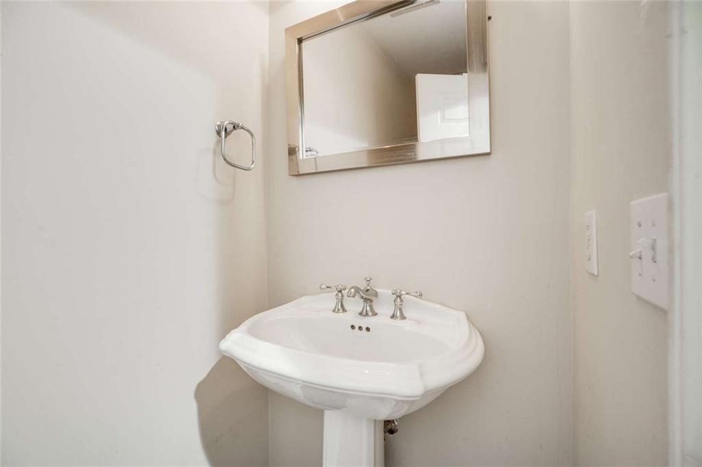 3275 Lenox Road Northeast, Unit 302 Atlanta, GA 30324 - Photo 24 of 50 a bathroom with a sink and a mirror
