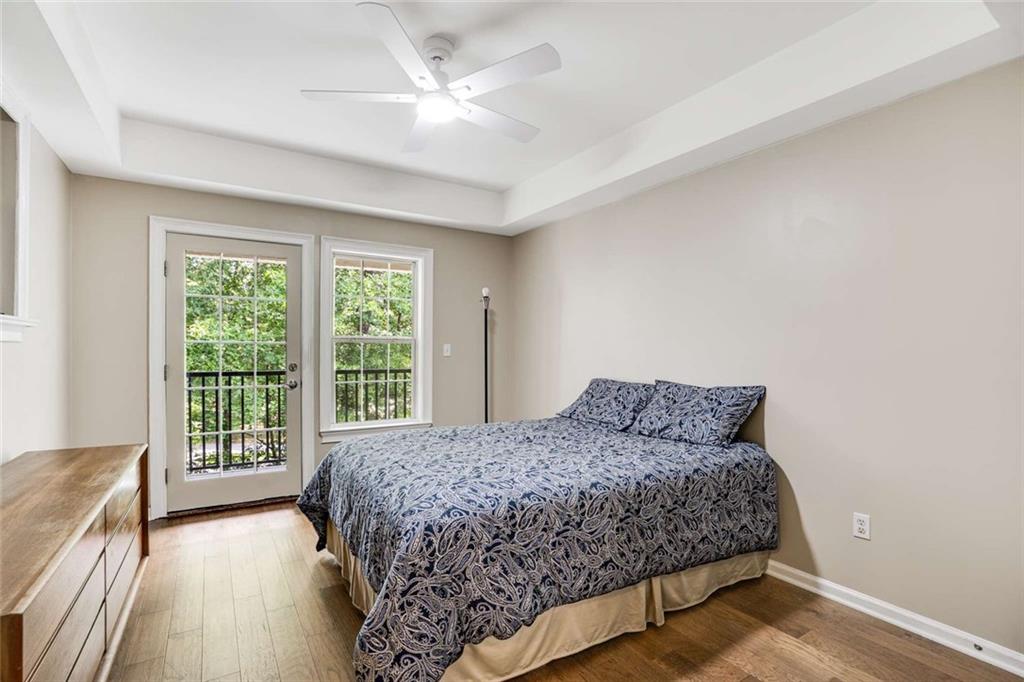 3275 Lenox Road Northeast, Unit 302 Atlanta, GA 30324 - Photo 27 of 50 a bedroom with a large bed and a large window