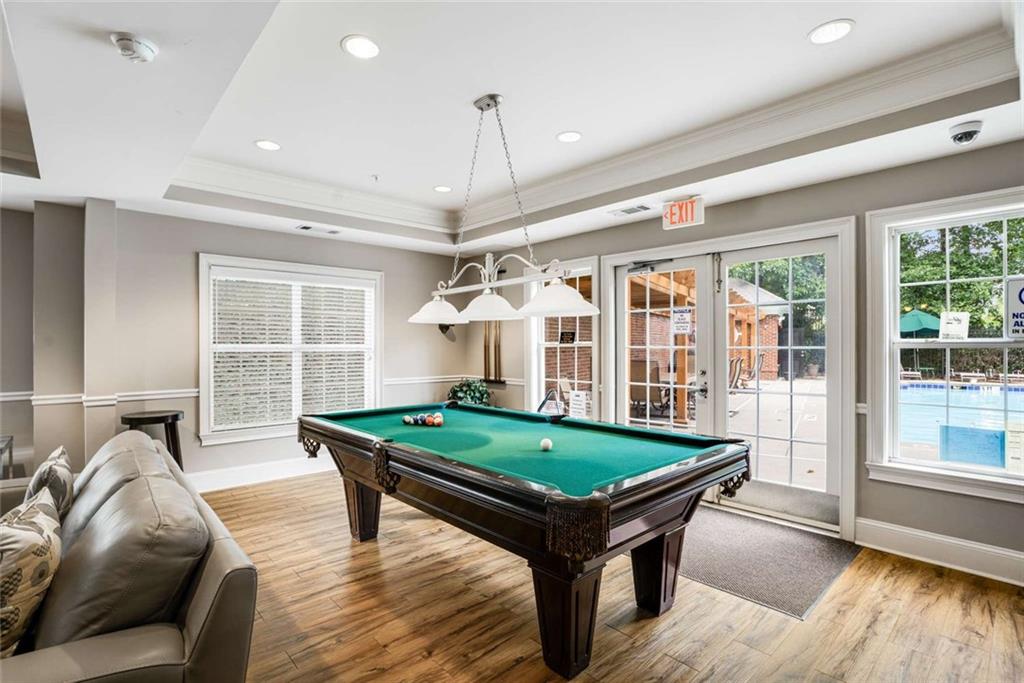 3275 Lenox Road Northeast, Unit 302 Atlanta, GA 30324 - Photo 39 of 50 a living room with furniture pool table and a large window