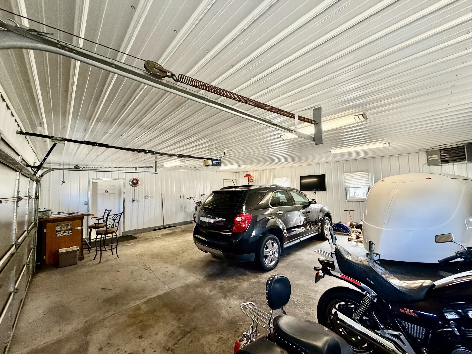 803 North Street Thomson, IL 61285 - Photo 18 of 26 a car parked in a garage