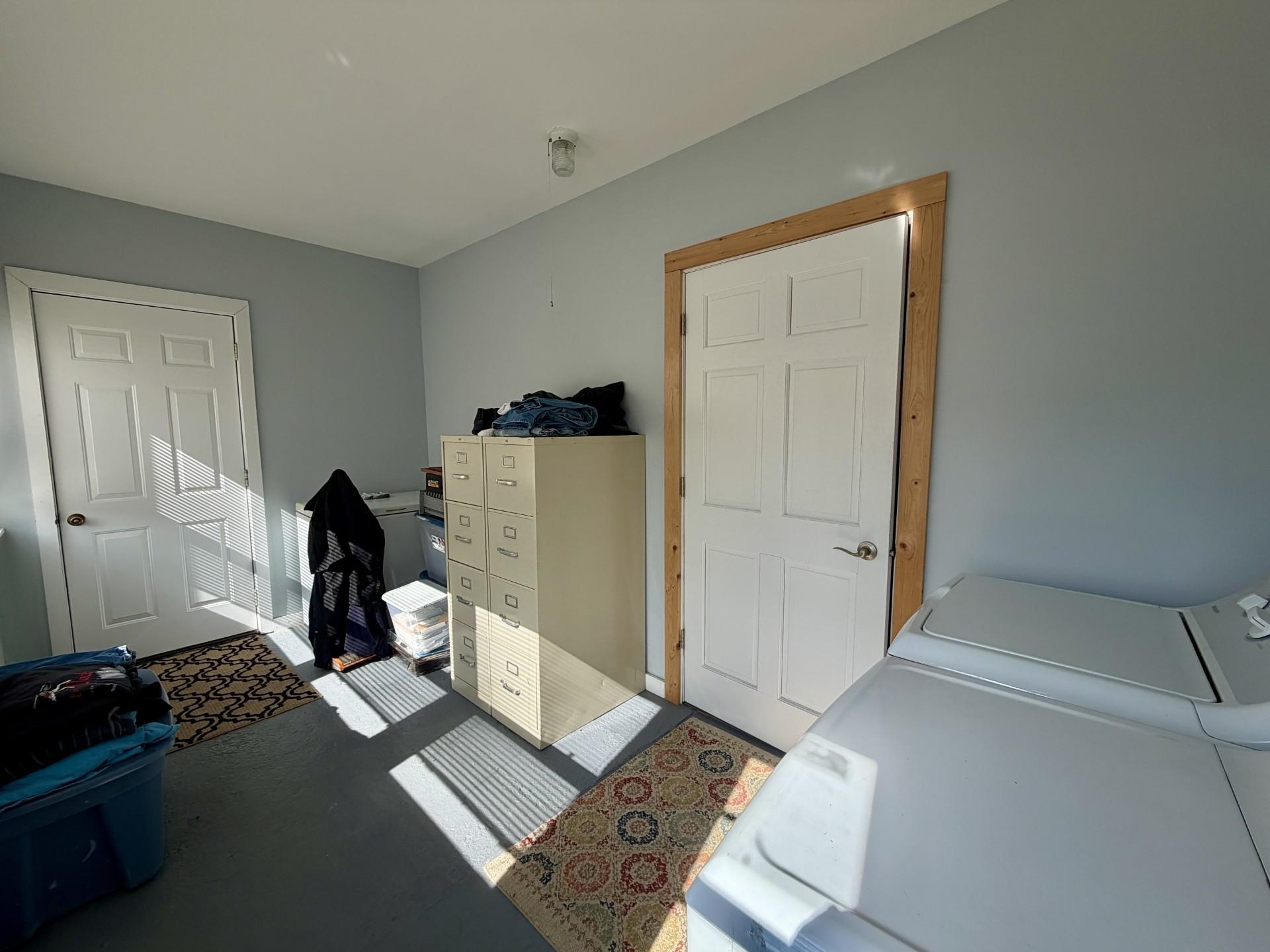 803 North Street Thomson, IL 61285 - Photo 19 of 26 a view of workspace with wooden floor windows and cabinet