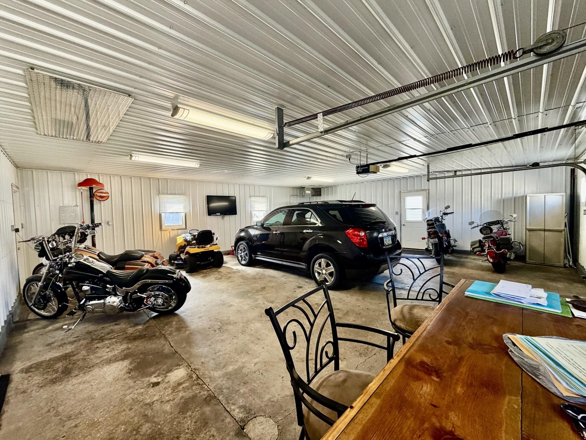 803 North Street Thomson, IL 61285 - Photo 21 of 26 a view of a garage with cars