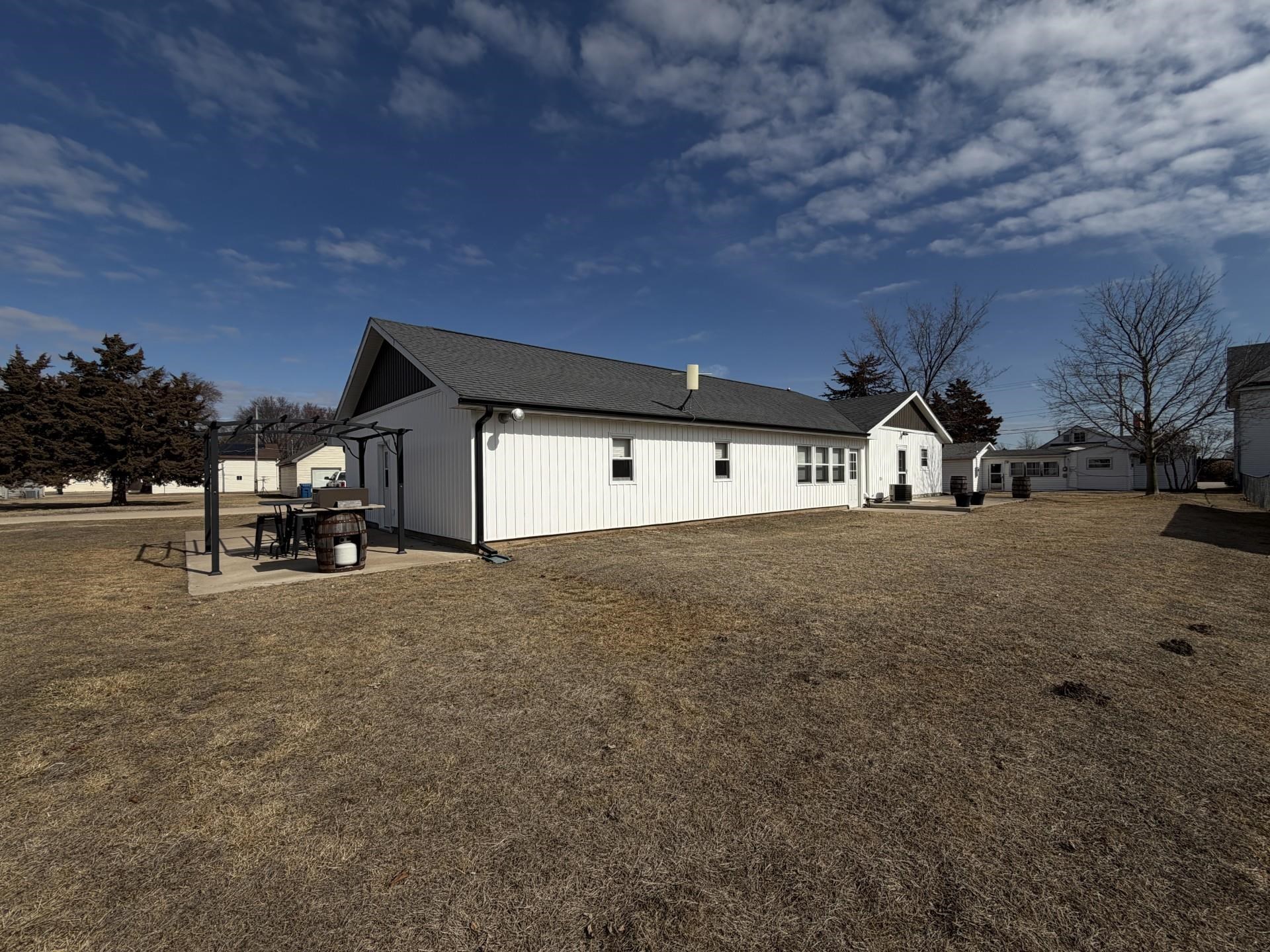 803 North Street Thomson, IL 61285 - Photo 22 of 26 a big house with a trees in the background
