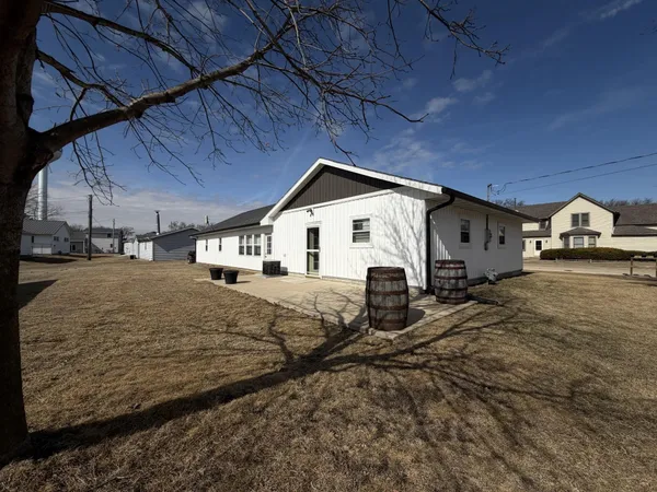 a view of a house with a snow in the yard
