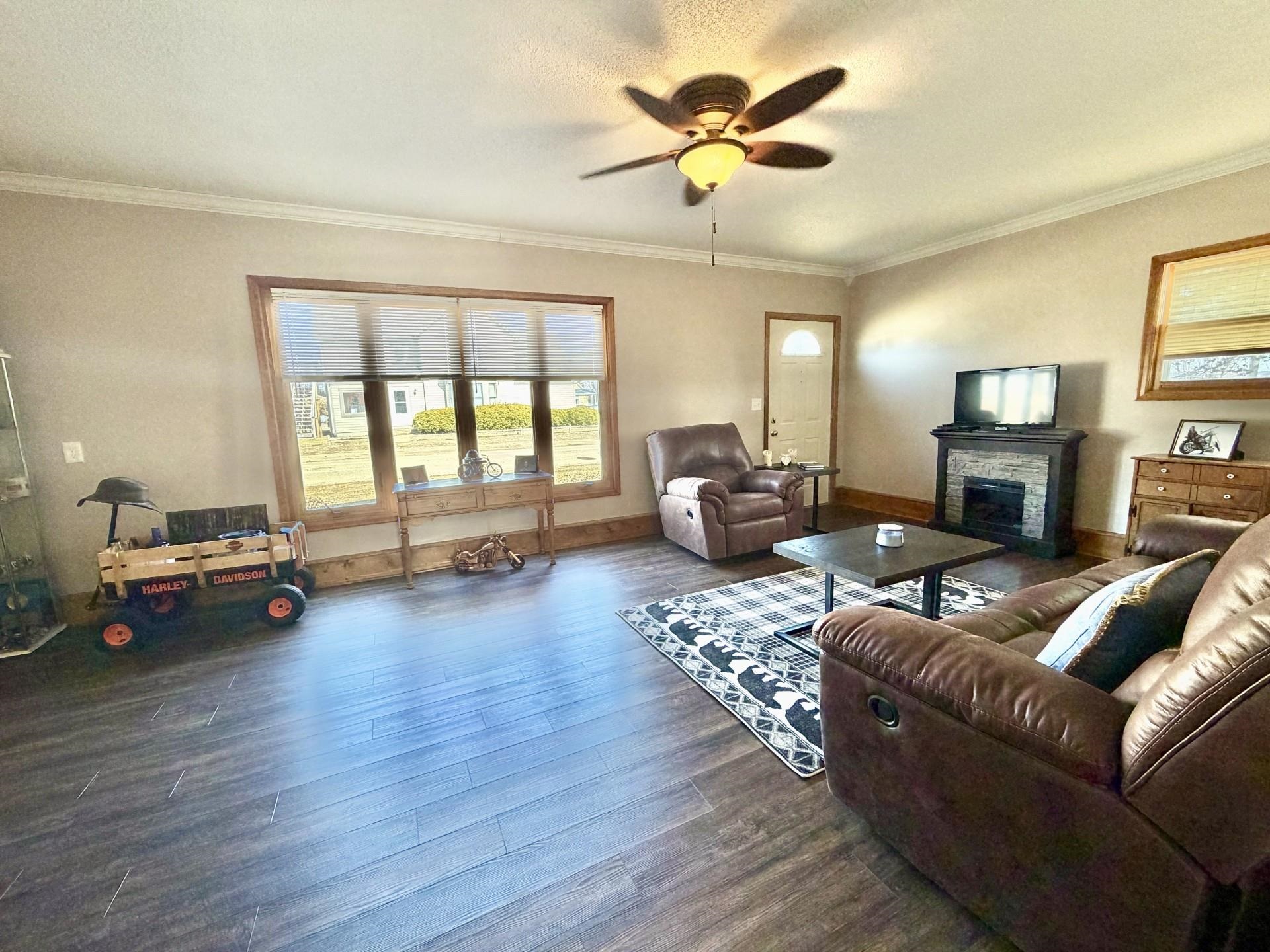 803 North Street Thomson, IL 61285 - Photo 4 of 26 a living room with furniture and a wooden floor