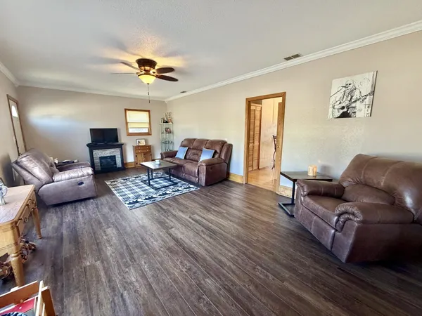 a living room with furniture or couch and a wooden floor